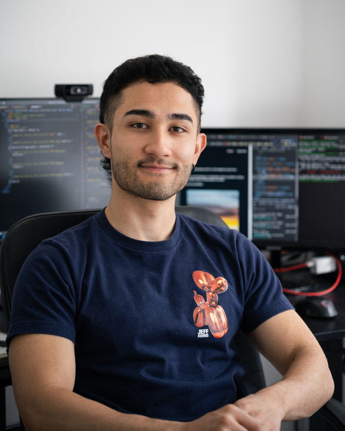 portrait of me sitting in front of computer screens